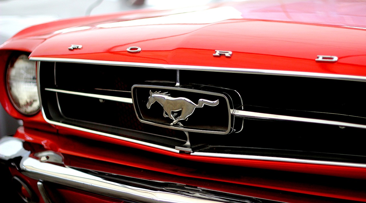 Front grill of a vintage red Ford Mustang